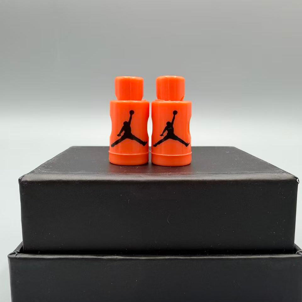 Coral Falt Lace lock with a black logo on a black box against a gray background